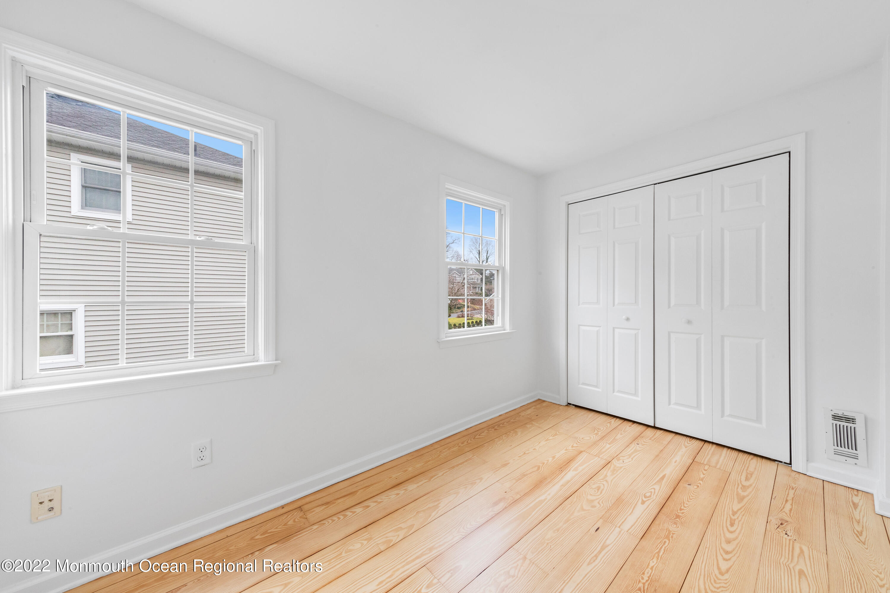 29 Church Street Rumson, NJ 07760 - Photo 30 of 42 a view of an empty room with wooden floor and a window