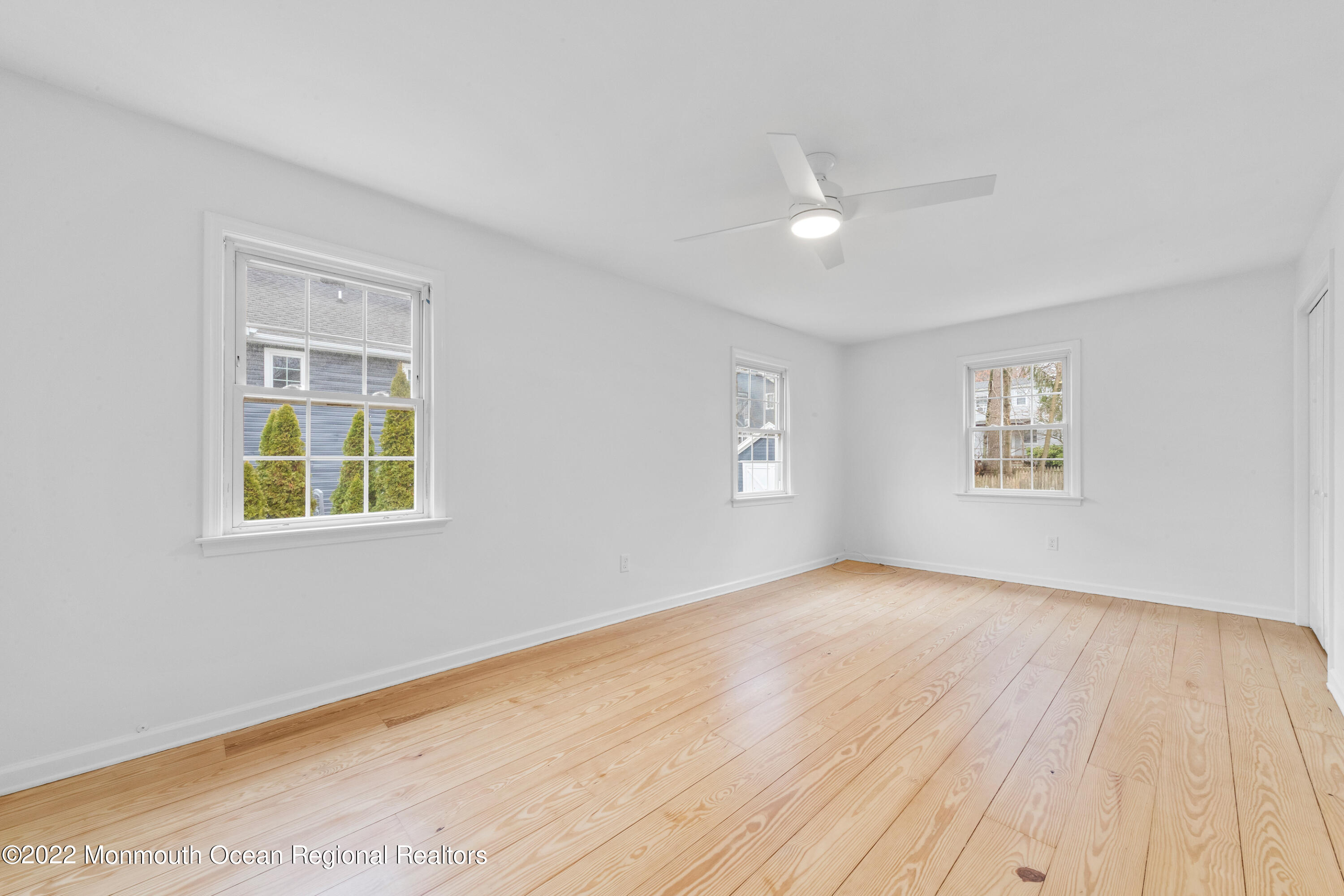 29 Church Street Rumson, NJ 07760 - Photo 33 of 42 a view of an empty room with a window and wooden floor