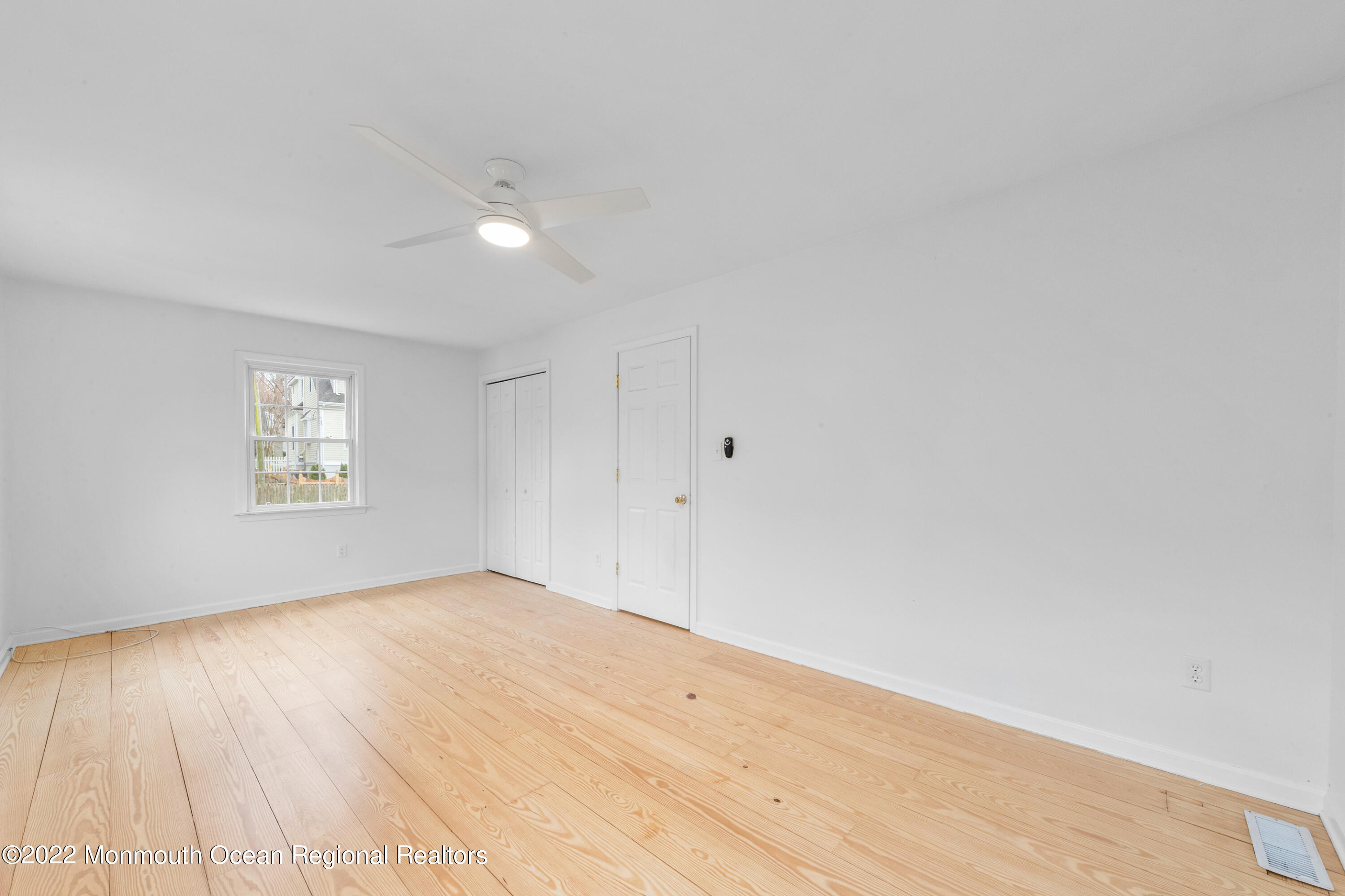 29 Church Street Rumson, NJ 07760 - Photo 34 of 42 a view of empty room with wooden floor and fan