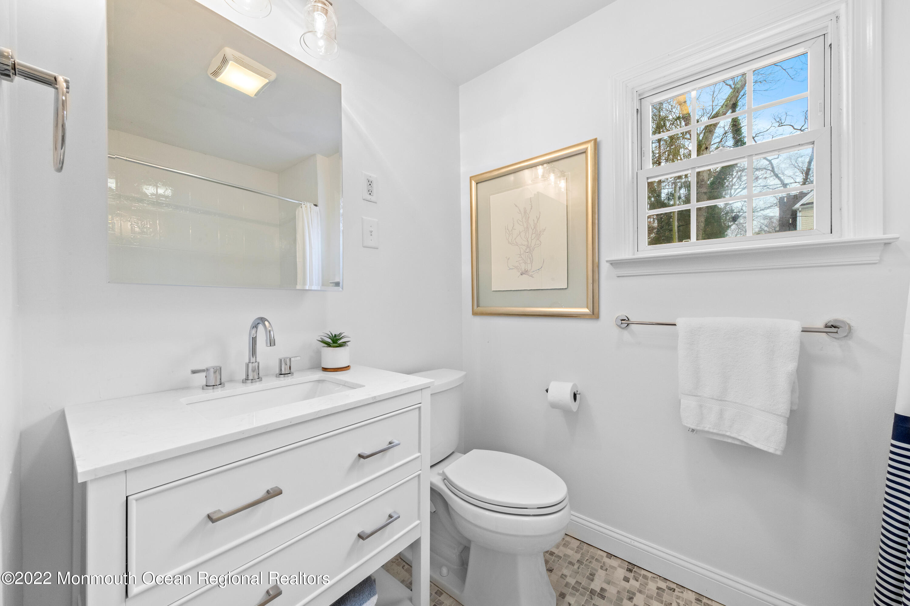 29 Church Street Rumson, NJ 07760 - Photo 37 of 42 a bathroom with a toilet sink vanity and mirror