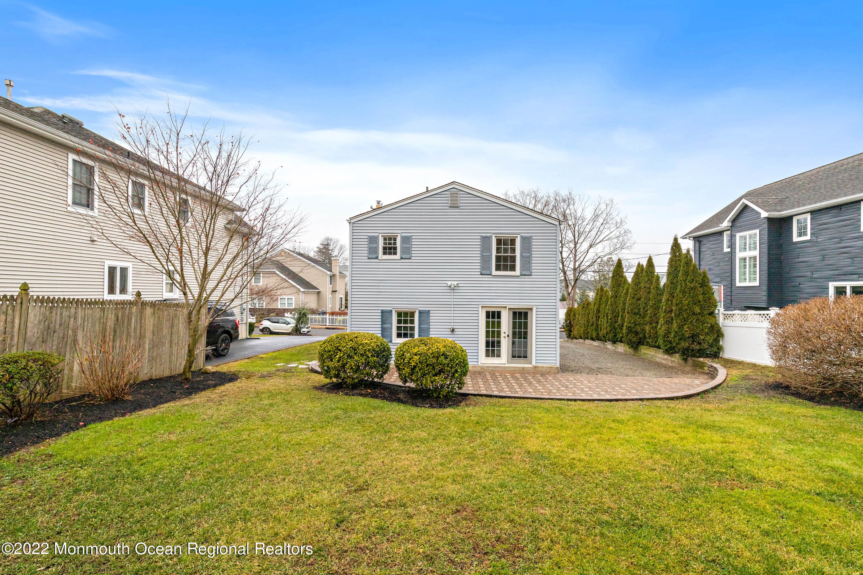 29 Church Street Rumson, NJ 07760 - Photo 39 of 42 a front view of a house with a garden