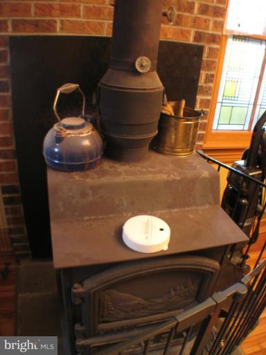 725 Stone Road Westminster, MD 21158 - Photo 25 of 26 wood stove in LR