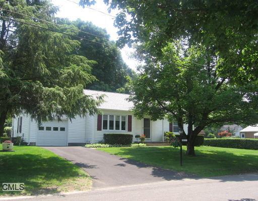 1 Albers Road Danbury, CT 06811 - Photo 1 of 1 a front view of a house with a garden and trees