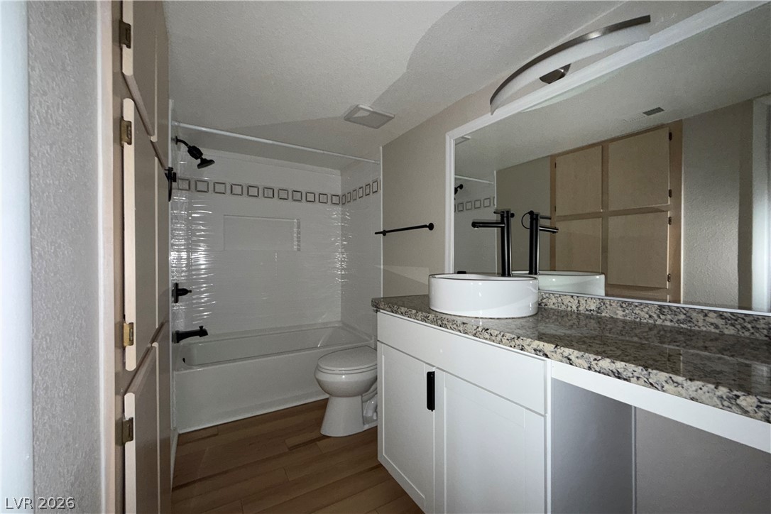 8101 West Flamingo Road, Unit 2131 Las Vegas, NV 89147 - Photo 5 of 13 A well-appointed bathroom features a contemporary vanity with a vessel sink and granite counters.