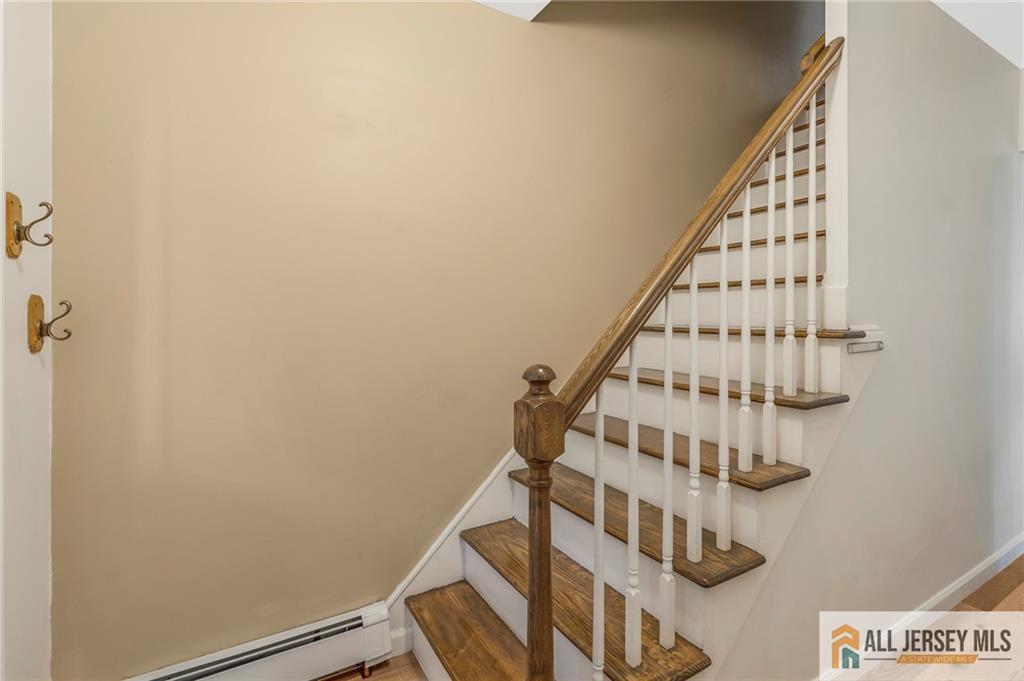 114 Runyon Avenue Middlesex, NJ 08846 - Photo 15 of 34 a view of staircase with rug and white walls