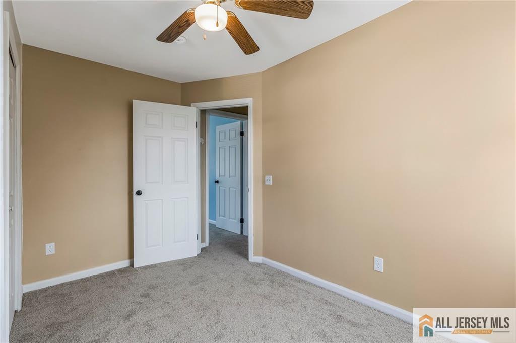 114 Runyon Avenue Middlesex, NJ 08846 - Photo 16 of 34 an empty room with a empty space and chandelier fan
