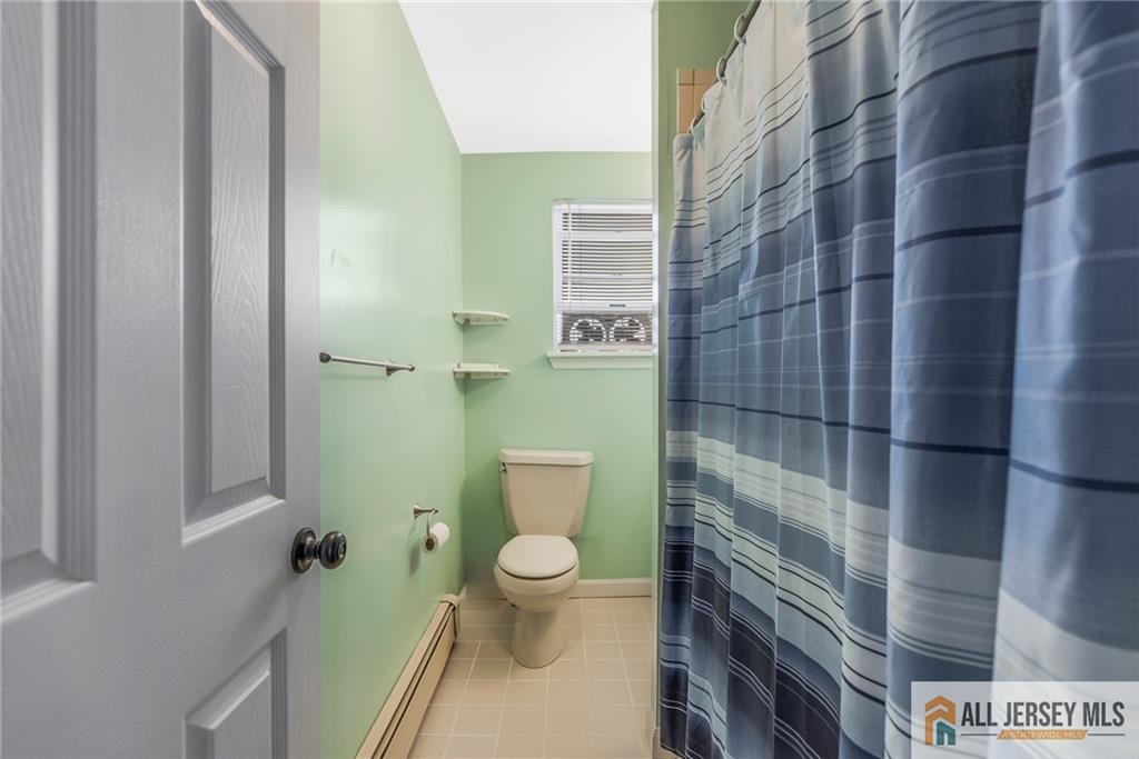 114 Runyon Avenue Middlesex, NJ 08846 - Photo 21 of 34 a bathroom with a toilet and a shower