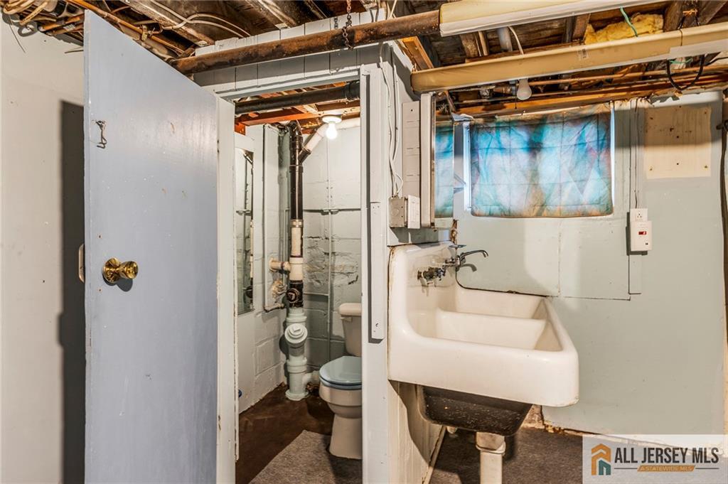 114 Runyon Avenue Middlesex, NJ 08846 - Photo 24 of 34 a bathroom with a sink and a mirror