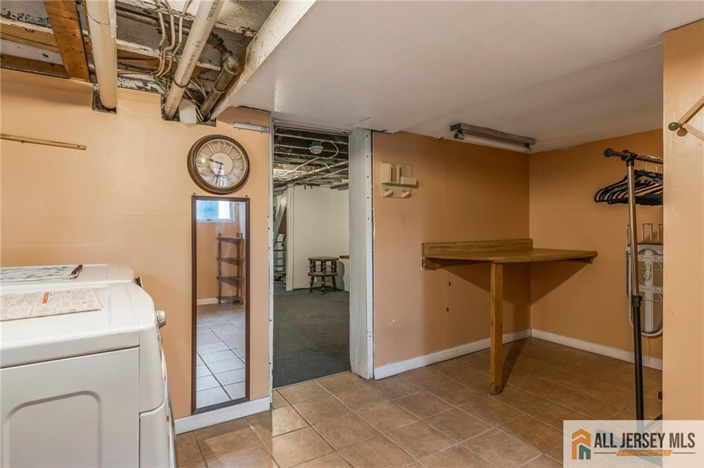 114 Runyon Avenue Middlesex, NJ 08846 - Photo 26 of 34 a view of a hallway with washer and dryer