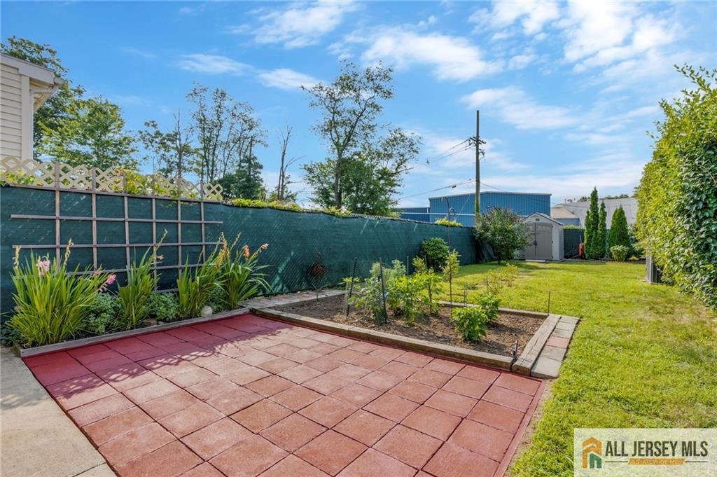 114 Runyon Avenue Middlesex, NJ 08846 - Photo 28 of 34 a view of a chair and table in the garden