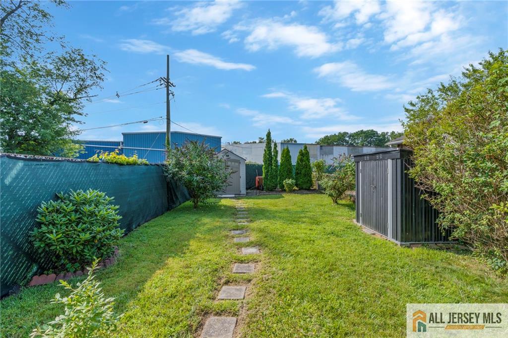 114 Runyon Avenue Middlesex, NJ 08846 - Photo 29 of 34 a view of a garden with a tree in the background