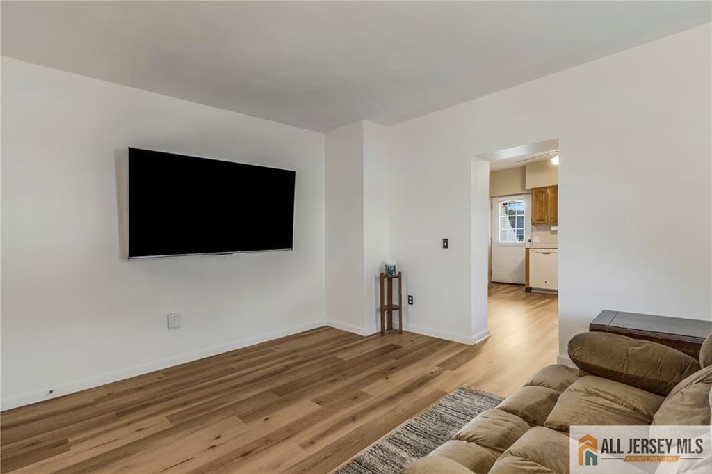 114 Runyon Avenue Middlesex, NJ 08846 - Photo 5 of 34 a view of a livingroom with wooden floor and couch