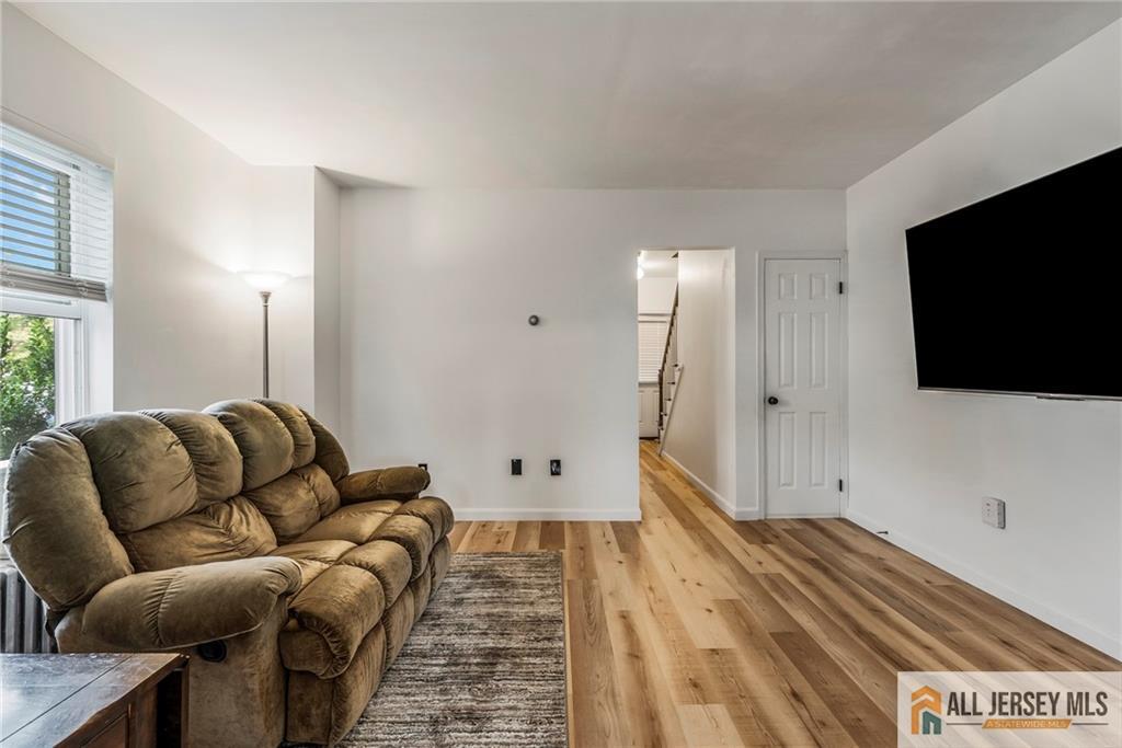 114 Runyon Avenue Middlesex, NJ 08846 - Photo 6 of 34 a living room with furniture and a flat screen tv