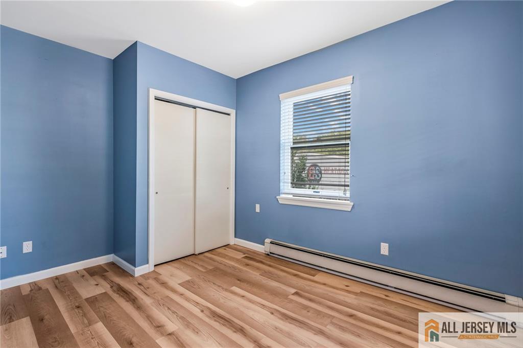 114 Runyon Avenue Middlesex, NJ 08846 - Photo 8 of 34 a view of a room with wooden floor and windows