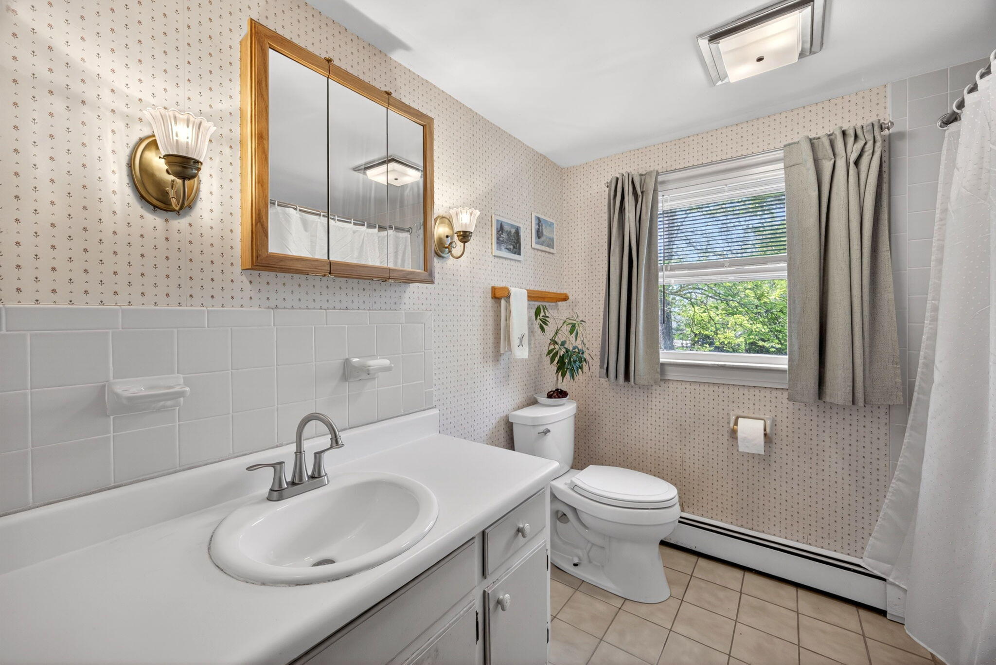 23 Nickerson Road Orleans, MA 02653 - Photo 15 of 54 a bathroom with a granite countertop sink toilet and mirror