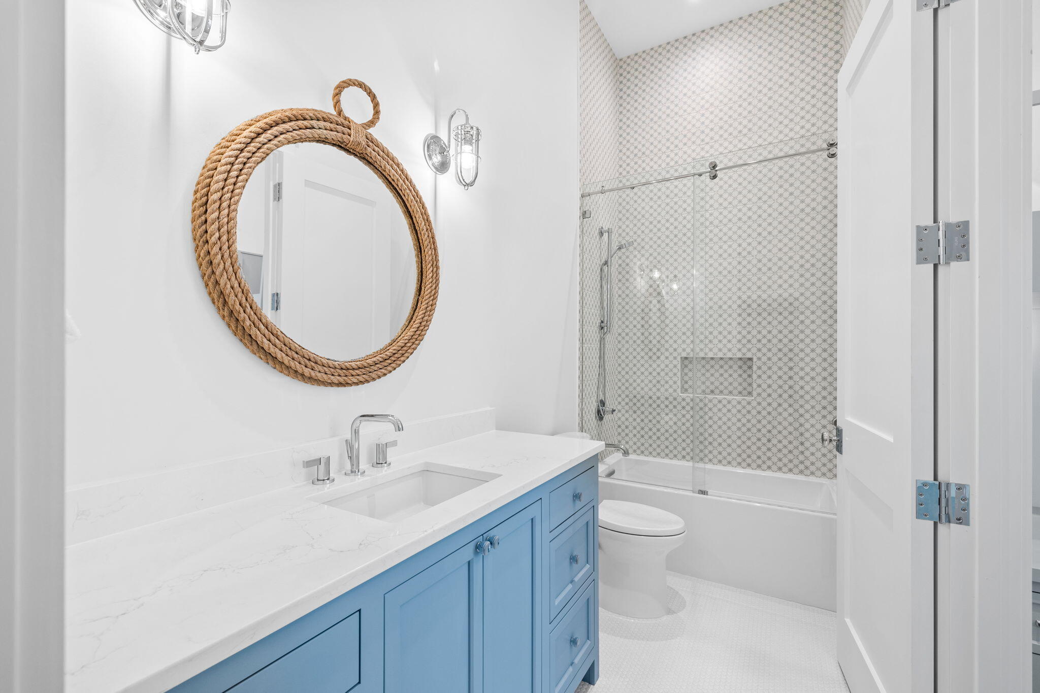 8103 East County Highway 30A Inlet Beach, FL 32461 - Photo 42 of 86 a bathroom with a sink a toilet and a mirror