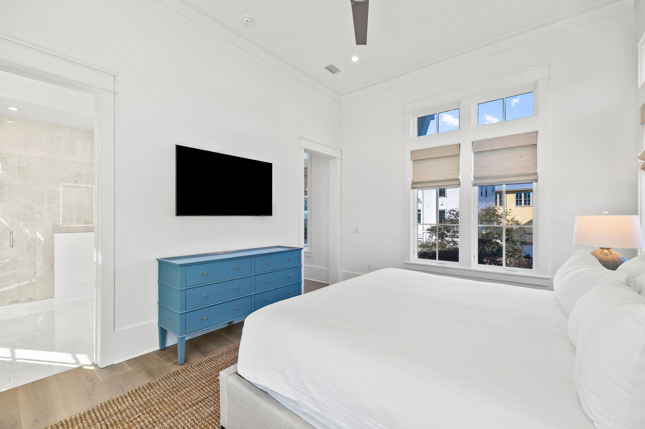 8103 East County Highway 30A Inlet Beach, FL 32461 - Photo 50 of 86 a spacious bedroom with a bed and a flat screen tv