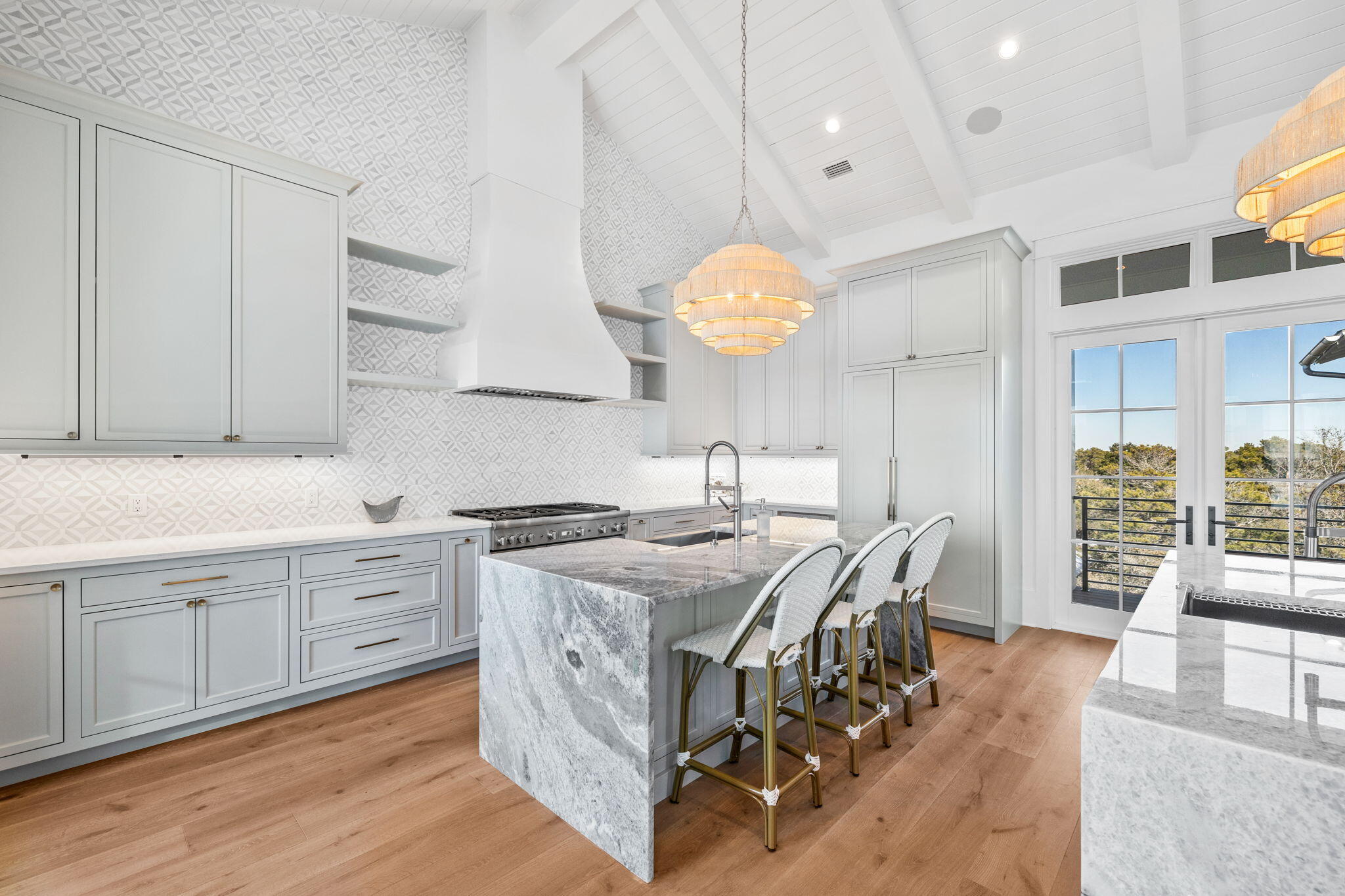 8103 East County Highway 30A Inlet Beach, FL 32461 - Photo 59 of 86 a kitchen with stainless steel appliances granite countertop a stove top oven a sink dishwasher and white cabinets with wooden floor