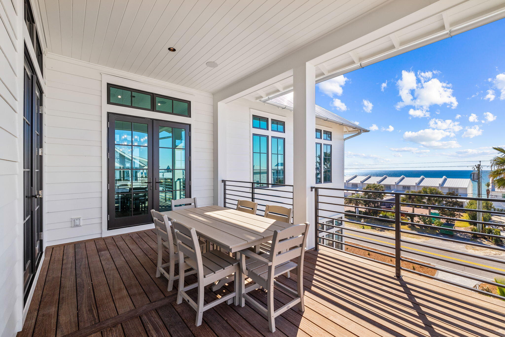 8103 East County Highway 30A Inlet Beach, FL 32461 - Photo 66 of 86 a view of a dining room with furniture and chandelier