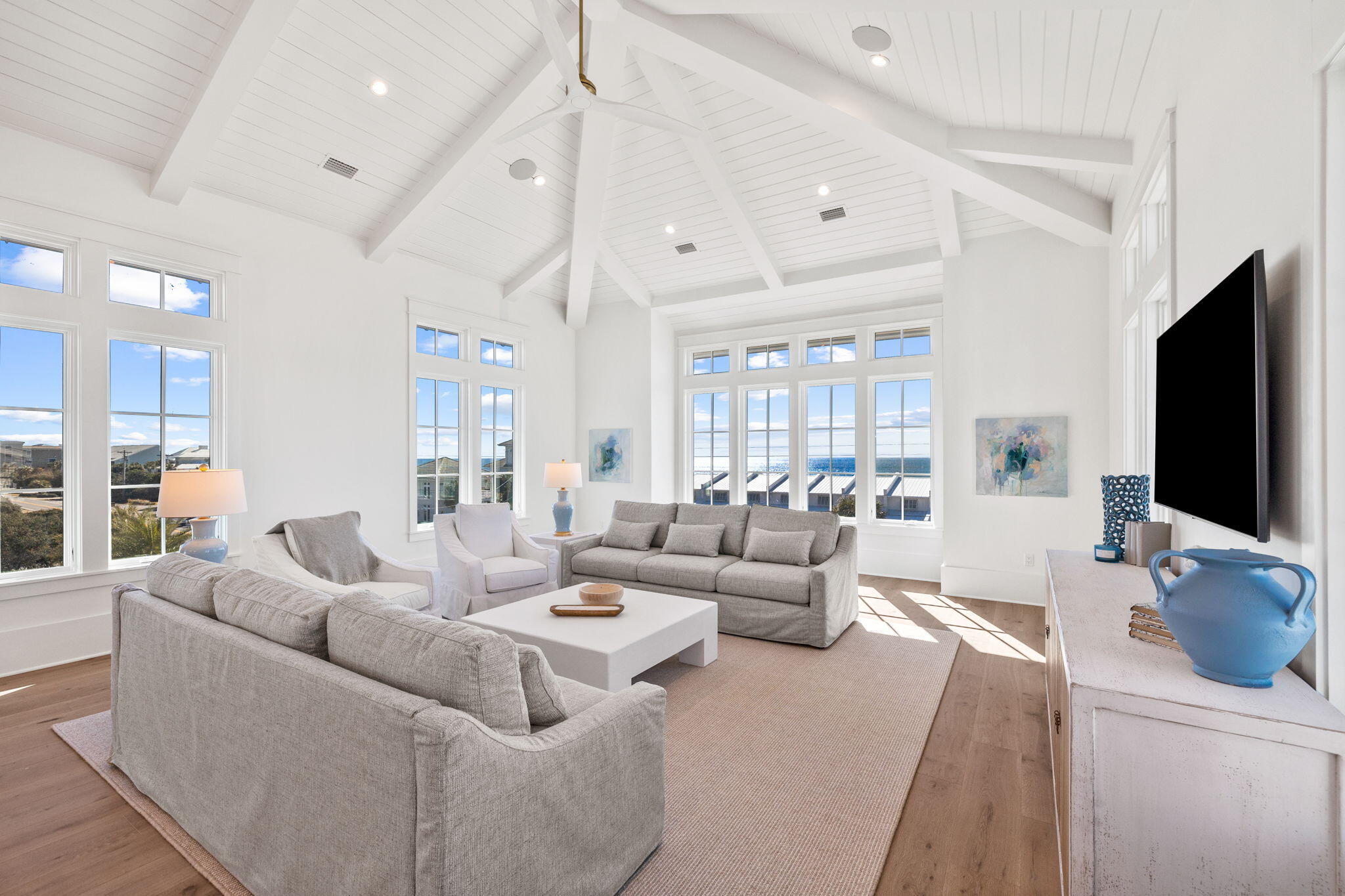 8103 East County Highway 30A Inlet Beach, FL 32461 - Photo 74 of 86 a living room with furniture and a flat screen tv