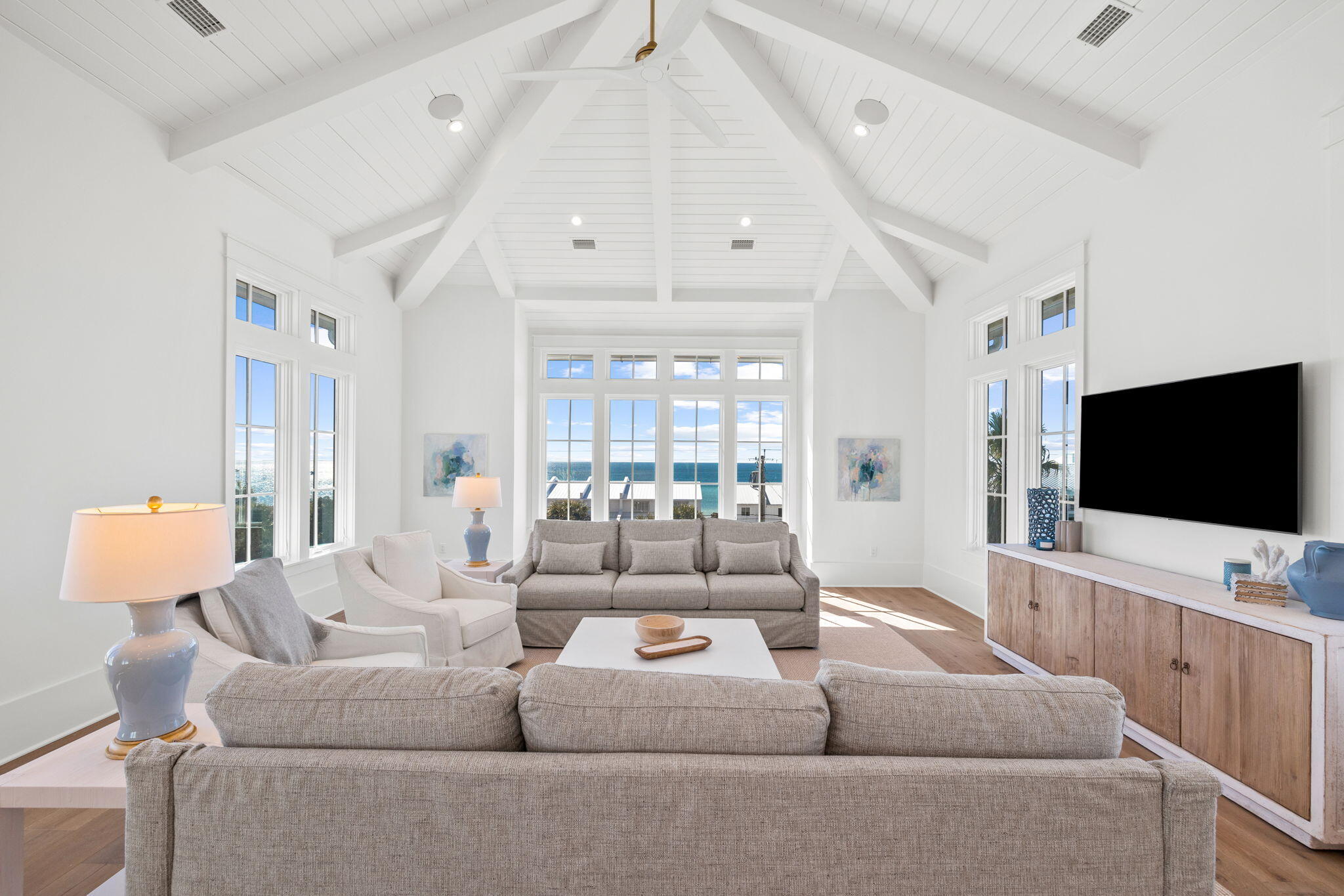 8103 East County Highway 30A Inlet Beach, FL 32461 - Photo 75 of 86 a living room with furniture and a flat screen tv