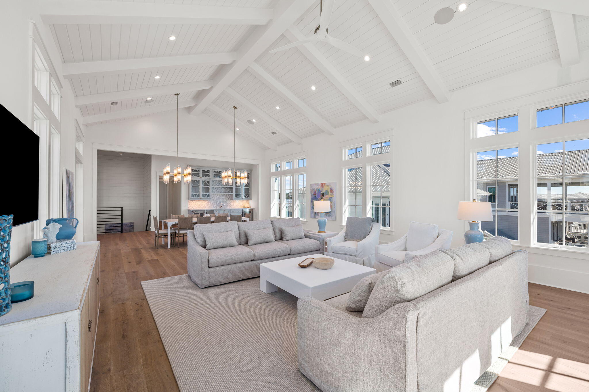 8103 East County Highway 30A Inlet Beach, FL 32461 - Photo 77 of 86 a living room with furniture and a flat screen tv