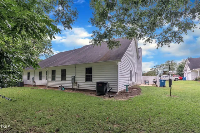 a view of a house with a yard porch and sitting area