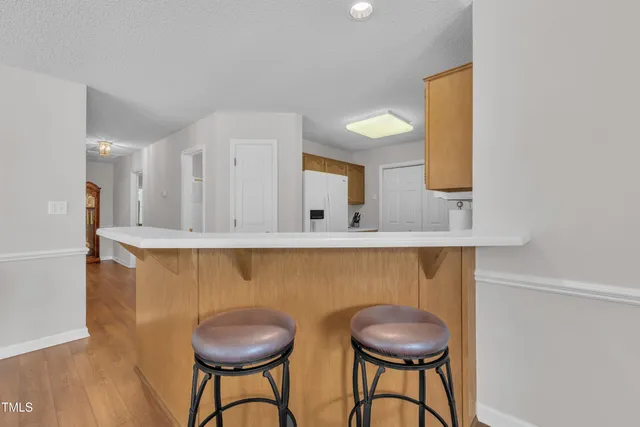 a kitchen with a table and chairs in it