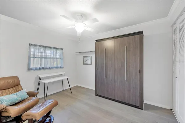 a view of a livingroom with furniture and a window
