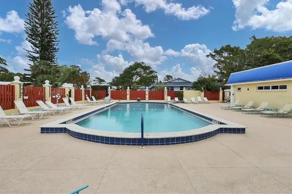 a view of a swimming pool with a yard