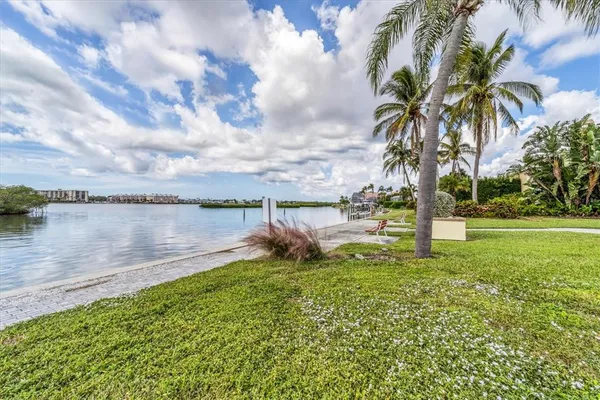 a view of a lake with a big yard