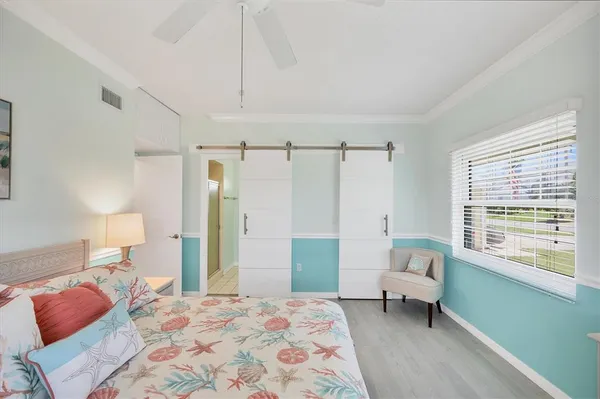 a bedroom with a bed and a couch