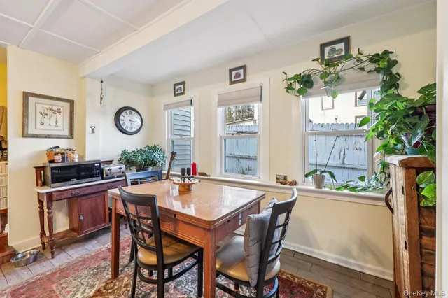 a dining area with furniture and window