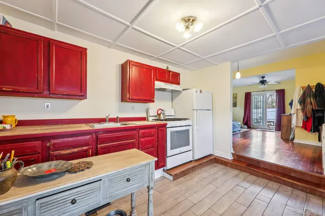 a kitchen with stainless steel appliances granite countertop a stove and cabinets