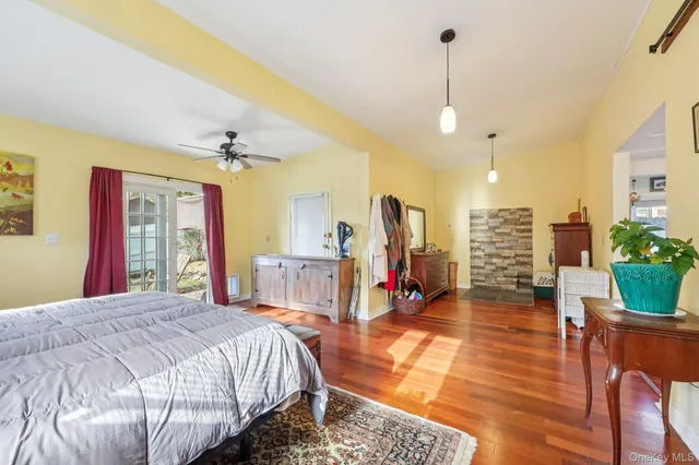 a bed room with a bed window and a television