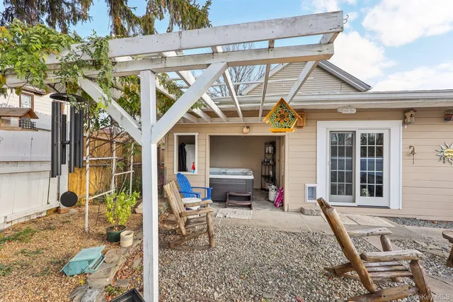 a view of a house with outdoor seating area