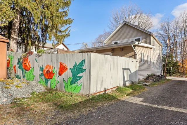 a view of a street with a tree in the background