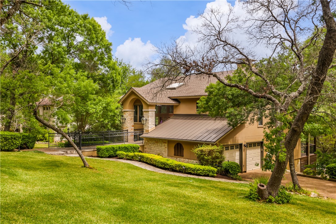 39 Pascal Lane Austin, TX 78746 - Photo 1 of 1 a view of a house with a yard