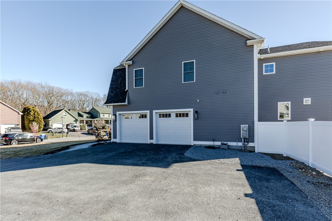 141 Fox Ridge Drive Cranston, RI 02921 - Photo 3 of 47 side of home, entrance to 2 car garage