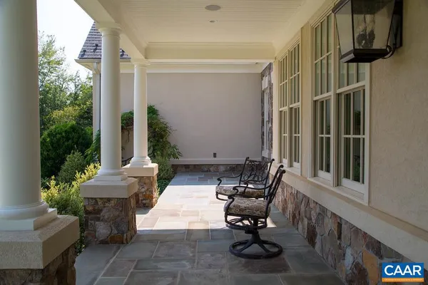 a living room with furniture potted plant and a fireplace