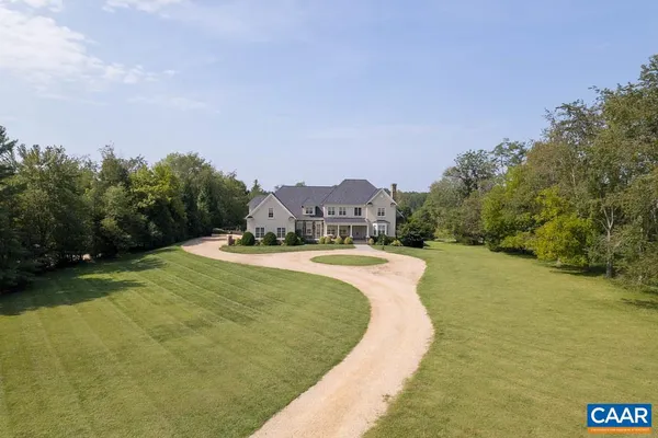 a view of a lake with a yard