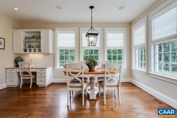 a bathroom with a granite countertop sink mirror and double