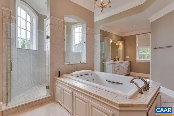 an empty room with windows and a fireplace