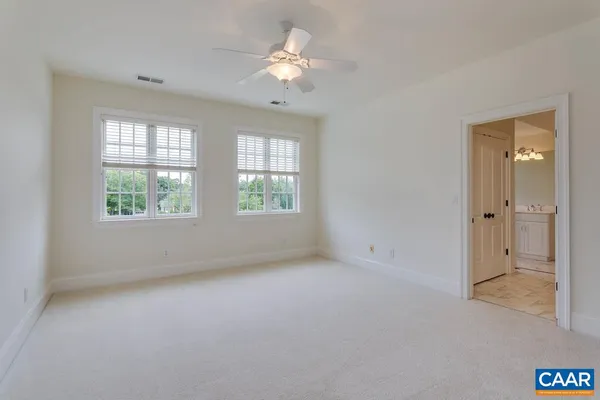 a living room with a fireplace and a flat screen tv
