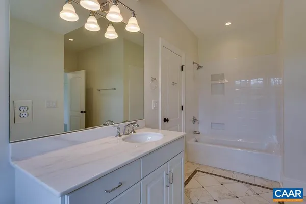 a kitchen with a sink a stove and cabinets