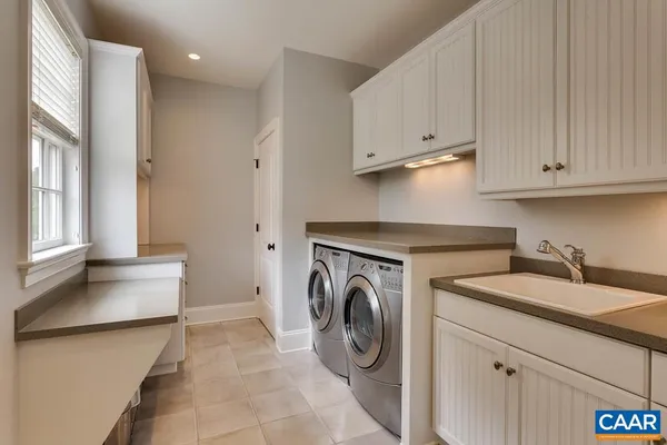 a bedroom with a bed and a flat tv screen