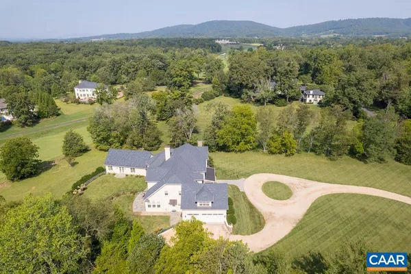 a front view of a house with a yard table and chairs