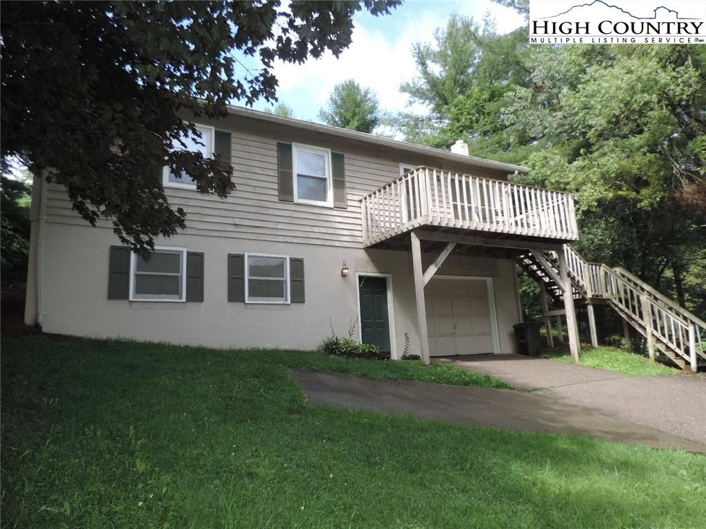 5416 Bamboo Road Boone, NC 28607 - Photo 1 of 24 a front view of a house with a garden