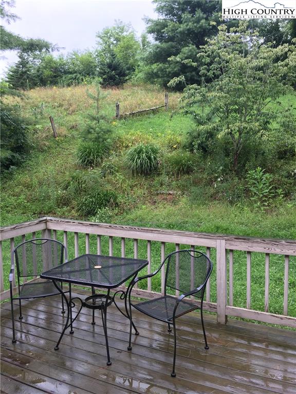 5416 Bamboo Road Boone, NC 28607 - Photo 24 of 24 a view of a chairs and table on the wooden deck