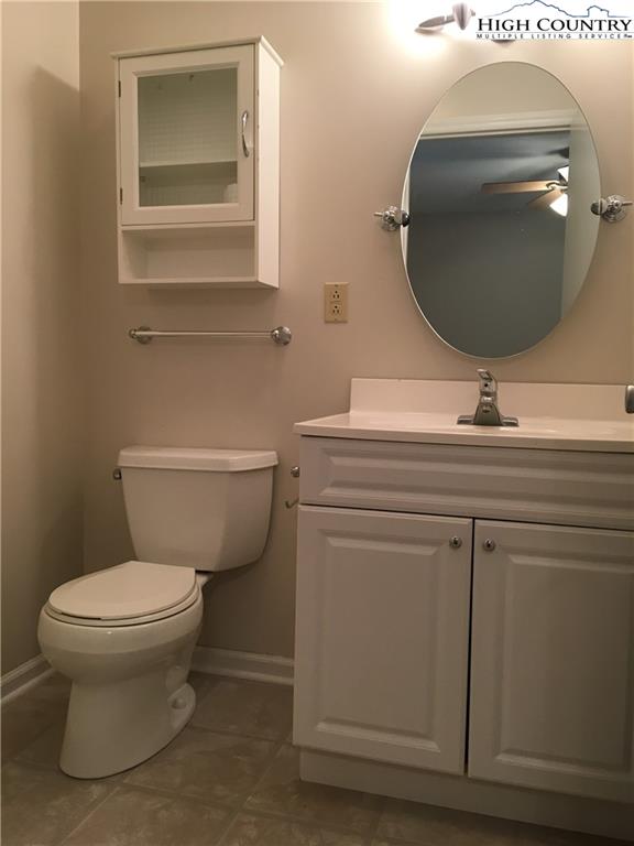 5416 Bamboo Road Boone, NC 28607 - Photo 4 of 24 a bathroom with a toilet sink and mirror